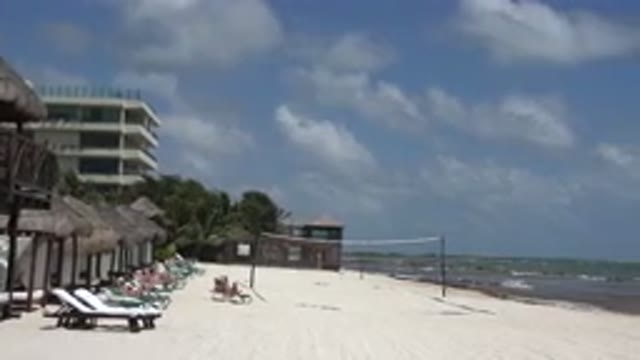PLAYA DEL CARMEN MEXICO-2015: People Relaxing In Chairs On White Beach With