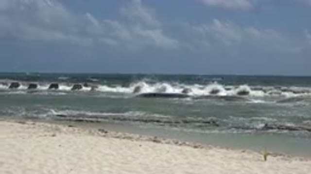 PLAYA DEL CARMEN MEXICO-2015: Cloudy Beach Day As The Waves Crash Down On The