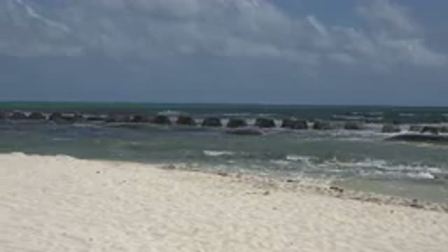 PLAYA DEL CARMEN MEXICO-2015: Sandy And Rocky Beach With Small Waves And Clear