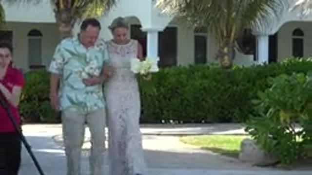 PLAYA DEL CARMEN MEXICO-2015: Woman in Dress Holding Bouquet of Flowers in Left Hand