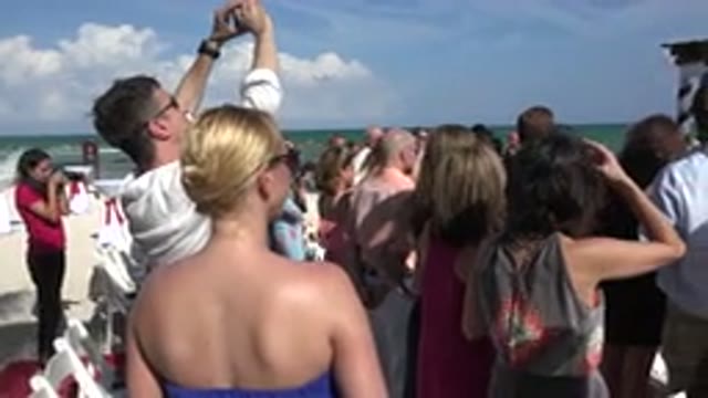 PLAYA DEL CARMEN MEXICO-2015: Back Of The Crowd At A Beach Wedding