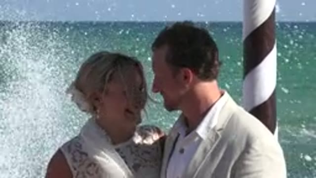 PLAYA DEL CARMEN MEXICO-2015: Couple At The Ocean With Splashing Waves In