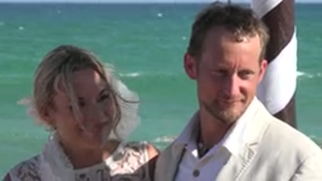 PLAYA DEL CARMEN MEXICO-2015: Couple Standing Near Blue Ocean Water And Brown