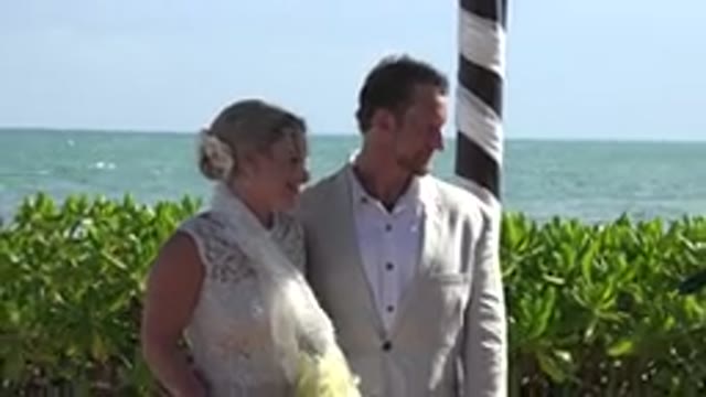 PLAYA DEL CARMEN MEXICO-2015: A Beautiful Bride And Groom Standing In A Beach