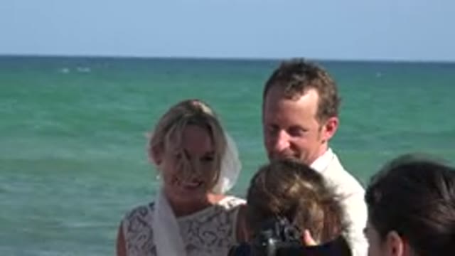 PLAYA DEL CARMEN MEXICO-2015: Famous Newlyweds Being Interviewed on the Beach