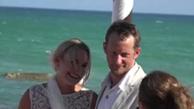 PLAYA DEL CARMEN MEXICO-2015: Couple Stands Near Blue Ocean Water On A Bright
