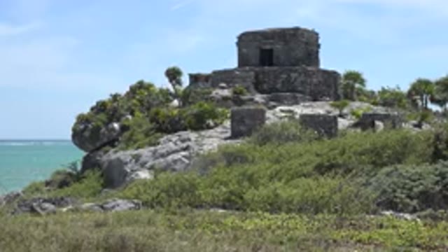 TULUM MEXICO-2015: Images Of An Old Castle Overlooking The Sea In The Midst Of