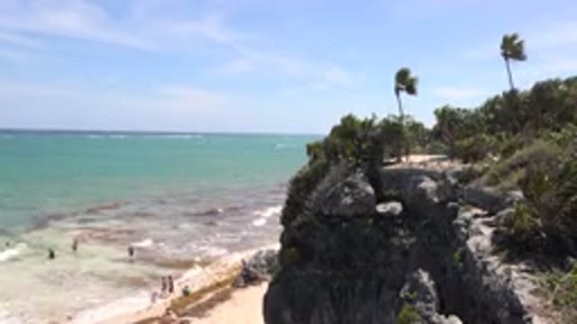 TULUM MEXICO-2015: People Walking Around On A Beach And Also Coming Down To The
