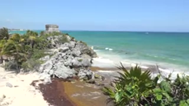 TULUM MEXICO-2015: Blue Ocean Water And Tan Beach On A Clear Day