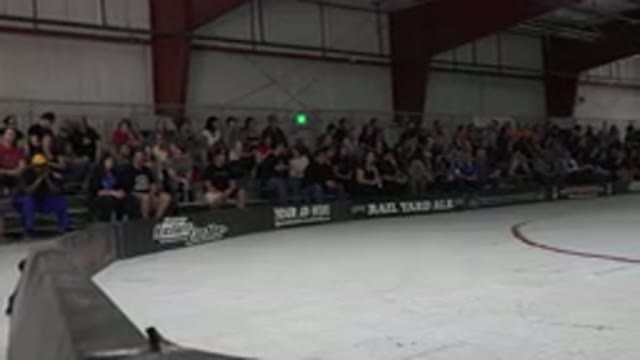 DENVER COLORADO-2015: Camera Pans From Left To Right Across Roller Derby Rink As
