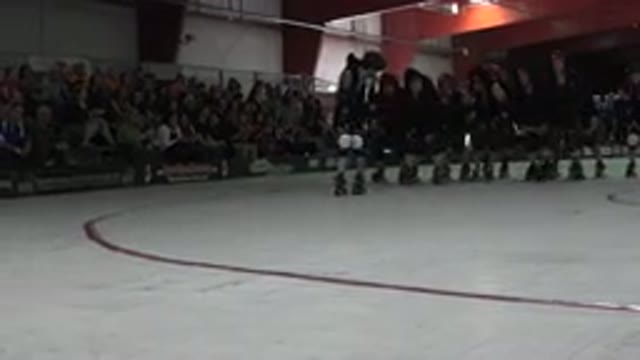 DENVER COLORADO-2015: Team Of Teenagers Rolling Skating In Arena Next To Each