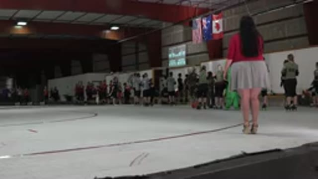 DENVER COLORADO-2015: People Standing On Roller Derby Rink All Looking Towards