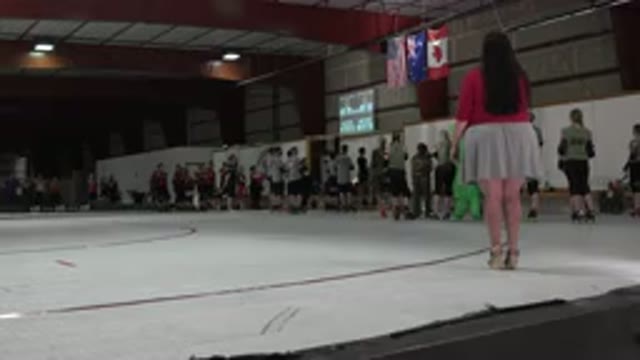 DENVER COLORADO-2015: Hypnotized People Watching A Big Screen On A Sports Court