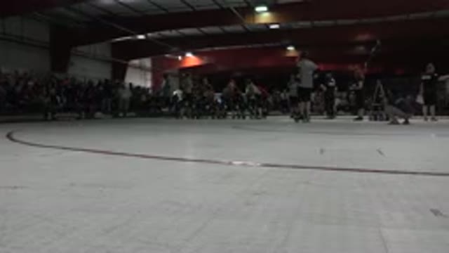 DENVER COLORADO-2015: Roller Derby Team Comes In To Circle To Stretch While