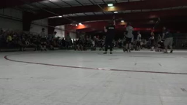 DENVER COLORADO-2015: Referee Signals Start of Roller Skating Match