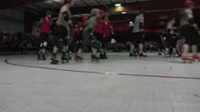 DENVER COLORADO-2015: Skaters Gliding on Red and White Indoor Rink