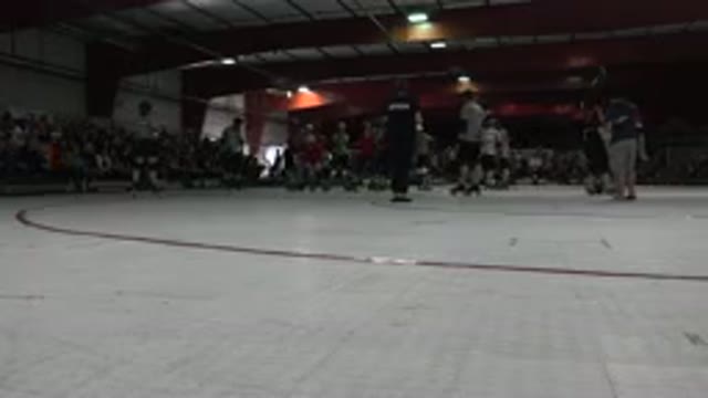 DENVER COLORADO-2015: Skaters Skate On Red And White Indoor Roller Rink