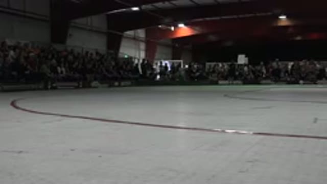 DENVER COLORADO-2015: A Large Crowd Surrounding A Large White Ice Skating Rink