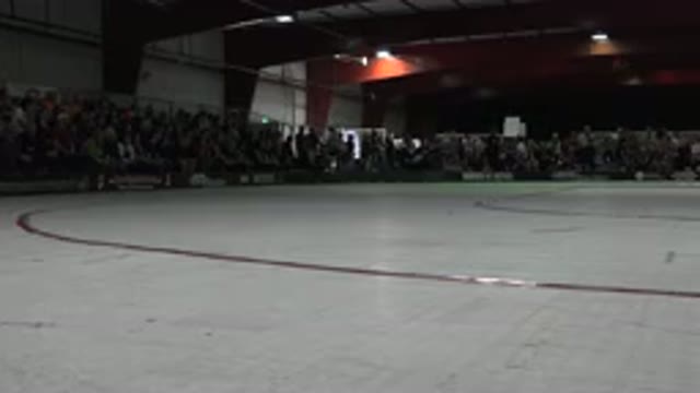 DENVER COLORADO-2015: Dim Lit Ice Hockey Arena Crowded With People Seated On Bleachers