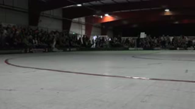 DENVER COLORADO-2015: People Roller Skate In A Large Arena While Cameras Flash