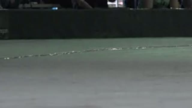 DENVER COLORADO-2015: Person Wearing Black Skates on Pale Gray Indoor Surface