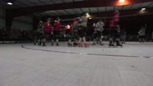 DENVER COLORADO-2015: Skaters Wearing Helmets And Knee Pads Warming Up On A Rink