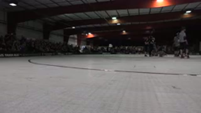 DENVER COLORADO-2015: White And Red Roller Derby Rink With Referees Standing In