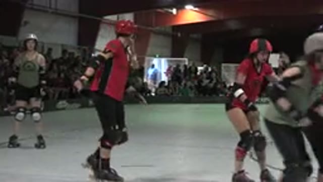 DENVER COLORADO-2015: Roller Derby Match Skaters And Referees Moving Around Rink