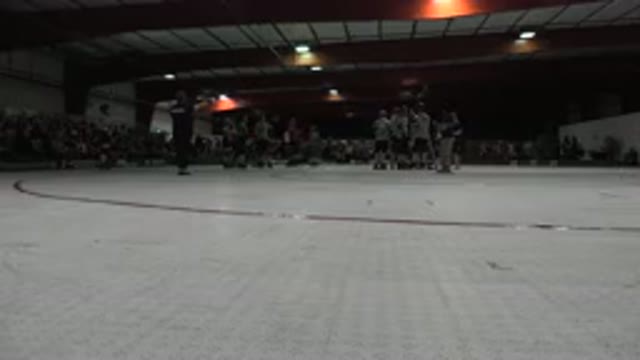 DENVER COLORADO-2015: Skating Match Between Two Teams Discussing Strategy