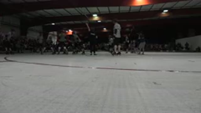 DENVER COLORADO-2015: A Few Groups Of Individuals Skating In A Ring With A Crowd