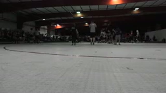 DENVER COLORADO-2015: People Are Roller Skating Around A Gymnasium In Front Of