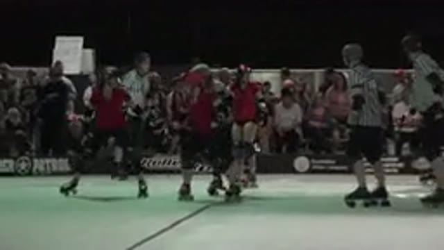 DENVER COLORADO-2015: Women Roller Skating At A Roller Derby Event With A Large Crowd