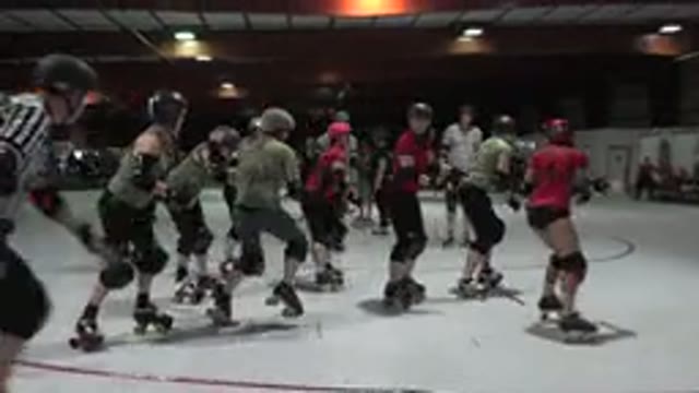DENVER COLORADO-2015: Roller Derby Teams Skating On White Indoor Rink