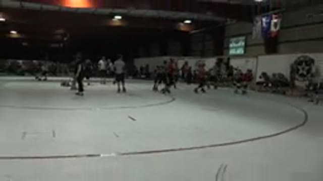 DENVER COLORADO-2015: Boys Playing Hockey On Ice In Black, White, And Red Uniforms