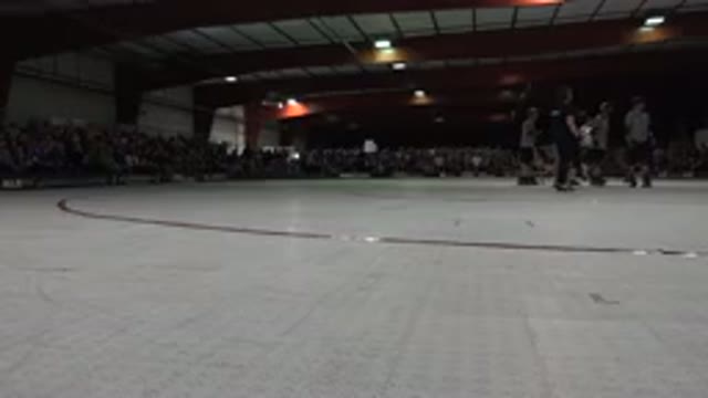 DENVER COLORADO-2015: A Group Of People In A Circle With Roller Skates And Pads