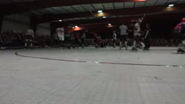 DENVER COLORADO-2015: Skaters Gliding on Red and White Indoor Roller Rink