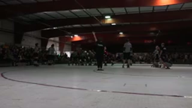 DENVER COLORADO-2015: Youth Hockey Teams In Green And Red Face Off At Skating Rink
