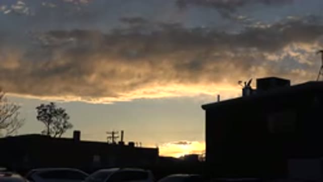 DENVER COLORADO-2015: Sunset on Roof Deck with City Skyline