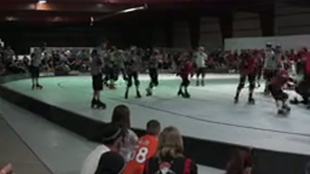 DENVER COLORADO-2015: Roller Derby Skaters On White And Red Indoor Skating Rink