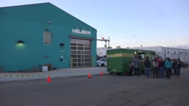 DENVER COLORADO-2015: Industrial Workers Lined Up At A Green Food Truck During A Lunch Break