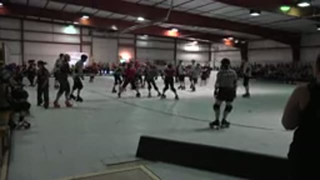 DENVER COLORADO-2015: Roller Derby Confident Skaters On White And Reddish Indoor Rink