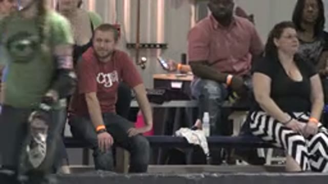 DENVER COLORADO-2015: Roller Derby Patrons Watch Referee Call Timeout For Red Team
