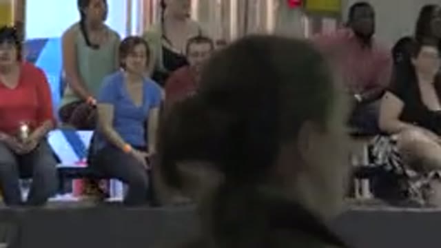 DENVER COLORADO-2015: Family Watches Ice Skaters Glide