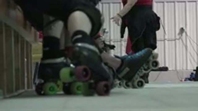DENVER COLORADO-2015: Legs Of People Wearing Skating Shoes With A Woman Walking
