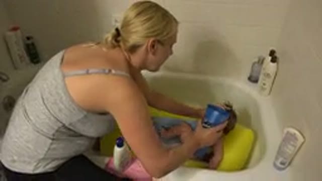 WESTMINSTER COLORADO-2015: Blonde Mother Bathing Baby with Cup