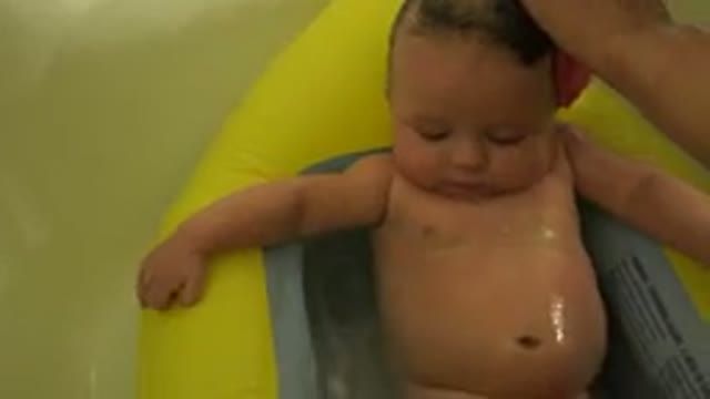 WESTMINSTER COLORADO-2015: A Small Baby Receives a Tub Bath and Hair Wash