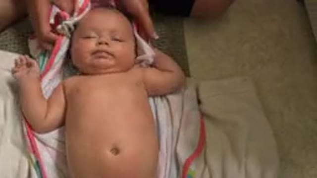 WESTMINSTER COLORADO-2015: Mother Carefully Wiping Baby With Towel After Bath