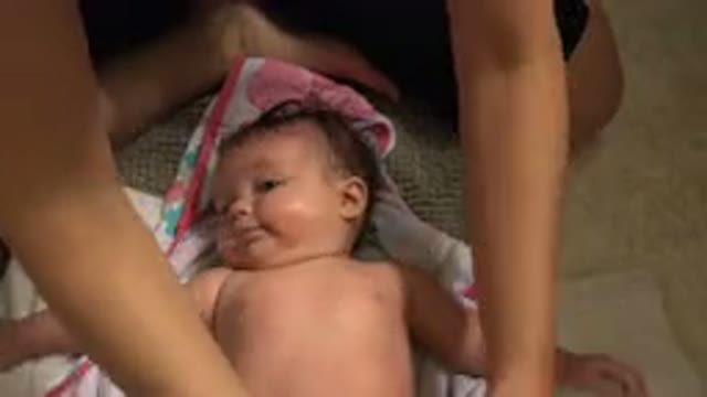 WESTMINSTER COLORADO-2015: A Person Is Drying A Little Baby With A Towel And