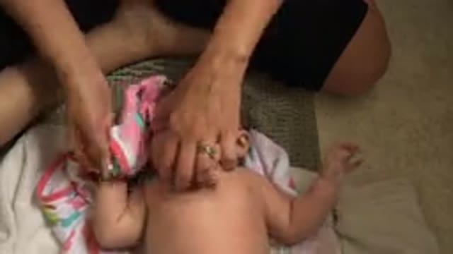 WESTMINSTER COLORADO-2015: Woman Wearing Black Dress Dries Baby With Pink Towel
