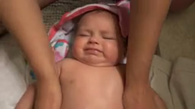 WESTMINSTER COLORADO-2015: Mom Giving Her Daughter A Massage While The Baby Lies